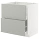 A white METOD kitchen cabinet with light grey drawers and a modern design.