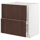 An ikea METOD kitchen unit. It is white with dark brown wooden drawers. The unit two large drawers with a sleek, modern design.