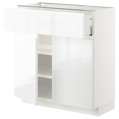White, modern, wall-mounted kitchen cabinet with shelves and drawers, high gloss finish.