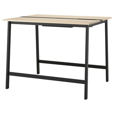 An MITTZON high conference table with a beige top and black metal legs. It includes a footrest for comfort and has a modern, minimalist design.