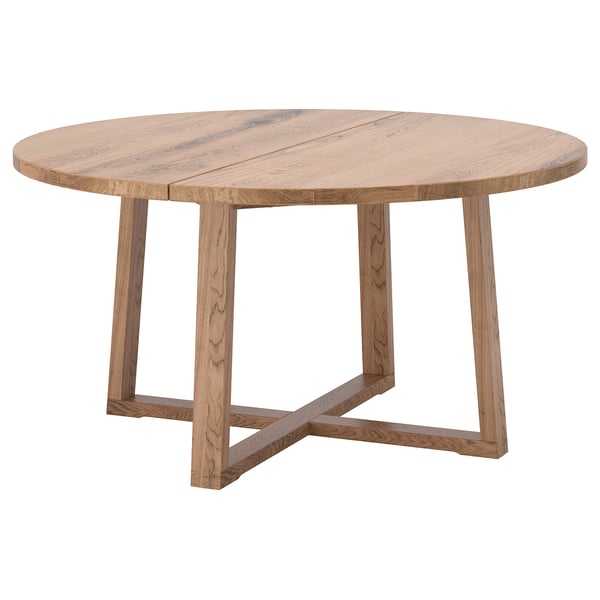 Rustic oak dining table with x-shaped legs.
