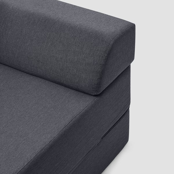 Dark grey sofa-bed corner, showing plush cushions with neat stitching, high-quality fabric, and comfortable padding.
