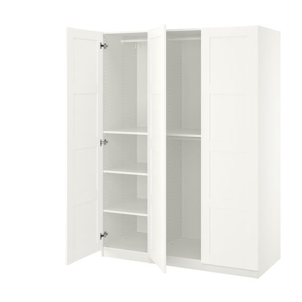 White PAX wardrobe with open doors, showing shelves and hinges.