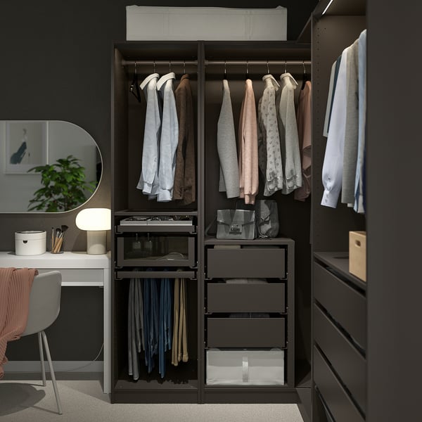 Dark PAX wardrobe organising clothes & accessories with hanging areas, shelves, & drawers.