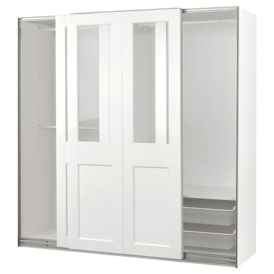 White PAX wardrobe with glass sliding doors, modern design, includes mesh basket, adjustable feet, soft-close doors.