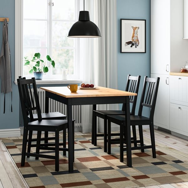 PINNTORP dining set: light wood table, 4 black chairs. Compact, under window, minimalist & cosy.