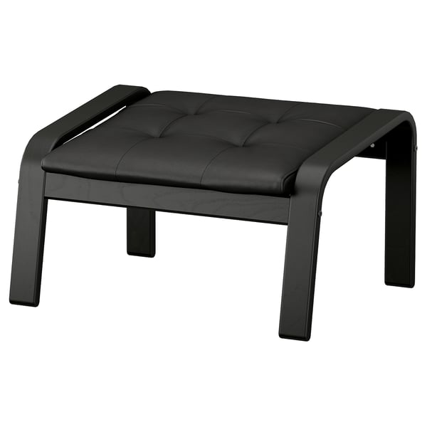 Black leather footstool with wooden legs, tufted cushion, sleek curved frame. Comfortable and stylish for relaxation.