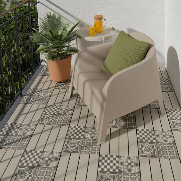 Beige RUNNEN floor decking with patterns. Green pillow on beige chair; plant and yellow bottles nearby.