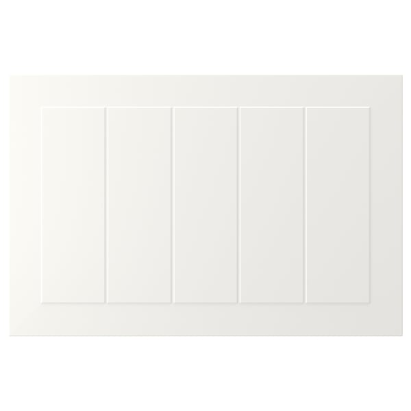 White STENSUND cabinet with grooved panels, sleek lacquered surface.