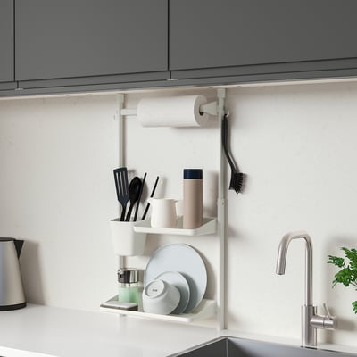 SUNNERSTA kitchen organiser under cabinets, holding kitchenware and paper towels.