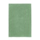 Green TOFTBO bath mat, rectangular, soft textured surface, recycled polyester, machine washable.