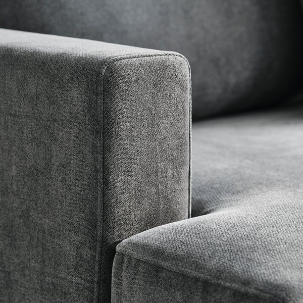 Close-up of stylish, high-quality sofa; plush cushions, clean lines, durable texture.