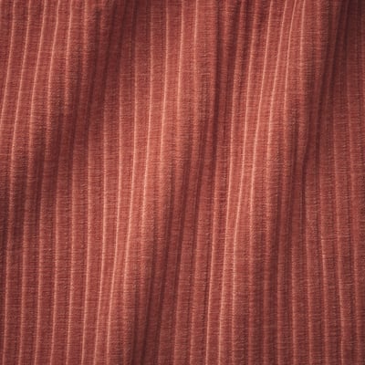 Close-up of burgundy fabric with subtle stripes, soft and plush texture, likely high-quality sofa material.