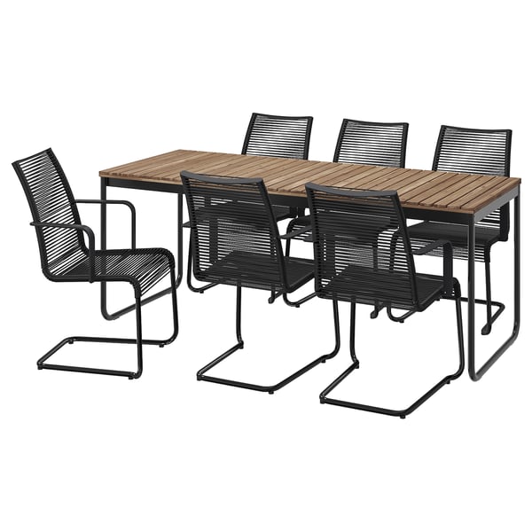 Modern outdoor dining set with rectangular wooden table and six black metal chairs, ideal for patio or deck use.