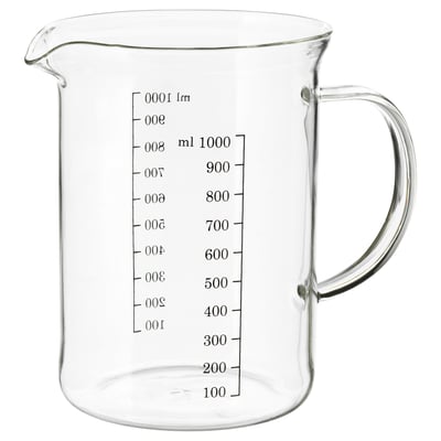 Clear glass measuring jug with handle and markings for measuring liquids.