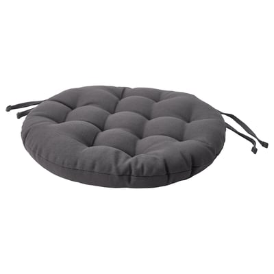 Round dark grey chair pad, tufted design, attaches with ties.