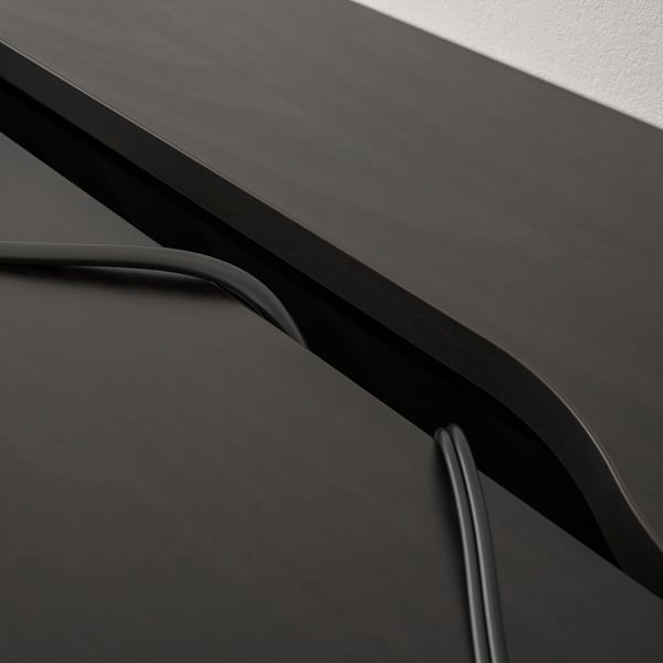 Modern desk with built-in drawers and cable management, tidy and sleek design.
