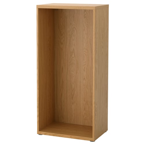 Empty BESTÅ oak shelf, minimalist design, adjustable feet.