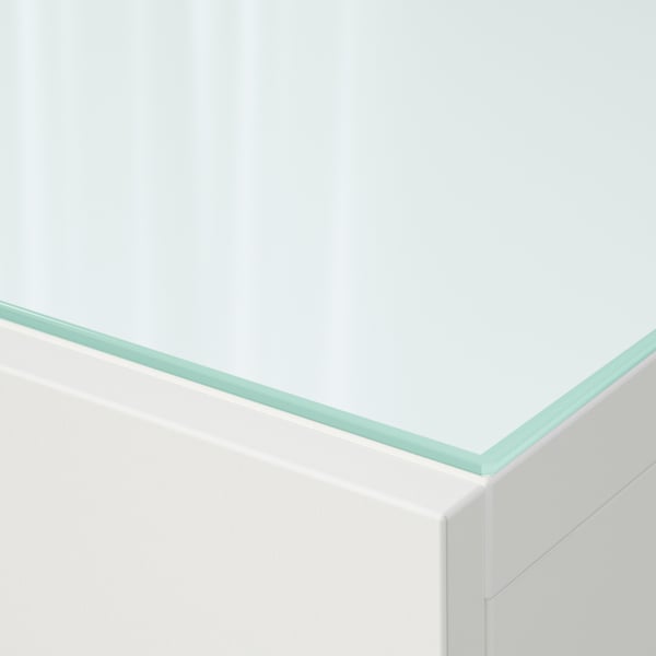 Glass panel close-up: sleek, clear, smooth edges, white background, modern design.