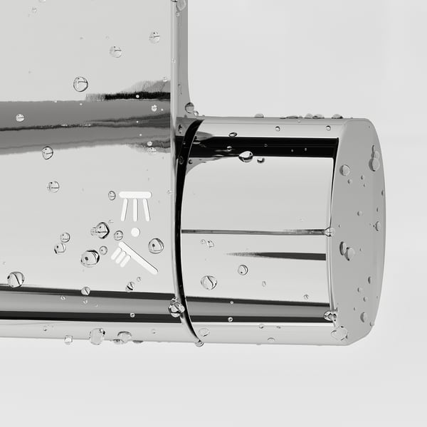 Black and white close-up of a chrome shower head with water droplets, displaying its intricate design and even spray coverage.