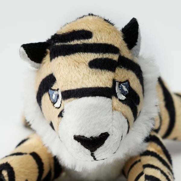 Stuffed tiger toy, soft & huggable, made of recycled polyester, detailed black stripes.