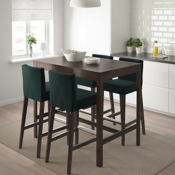 Dark brown bar table & 4 green stools in cosy kitchen