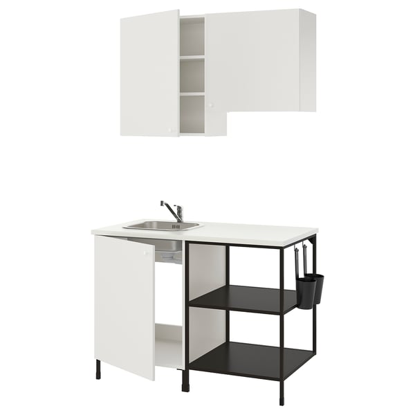 Modern white ENHET kitchen setup with a stainless-steel sink, black shelves, and sleek cabinets.