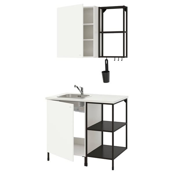 Modern, compact ENHET kitchen setup: white cabinet, black shelves, single-bowl sink, stainless steel tap.