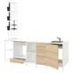 A modern, white and wooden kitchen setup with a sink and open storage shelves.
