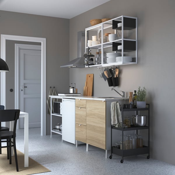 Modern kitchen with ENHET furniture: wooden cabinets, metal cart, organised shelves.