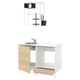Modern white kitchen unit with wooden drawer and round stainless steel sink, mounted shelves, utensils, and a tap.