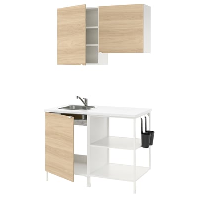 Modern kitchen setup with light wooden and white cabinets, stainless steel sink, and open shelving.