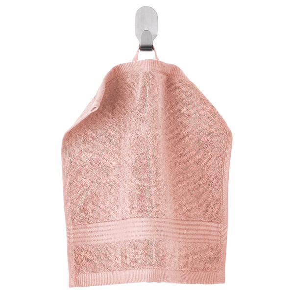Pink FREDRIKSJÖN cotton towel hangs on hook, soft with textured border.