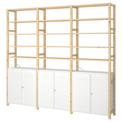 An IVAR wooden shelf and cabinet unit. It natural pine shelves and white metal cabinets. The design is modern and customizable.