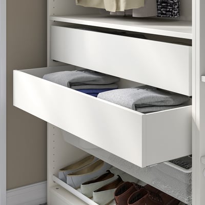 White KOMPLEMENT wardrobe drawer with grey folded clothes.