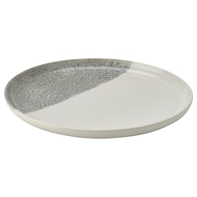 KRUSTISTEL plate, half white, half grey speckled, round, stoneware with textured design.