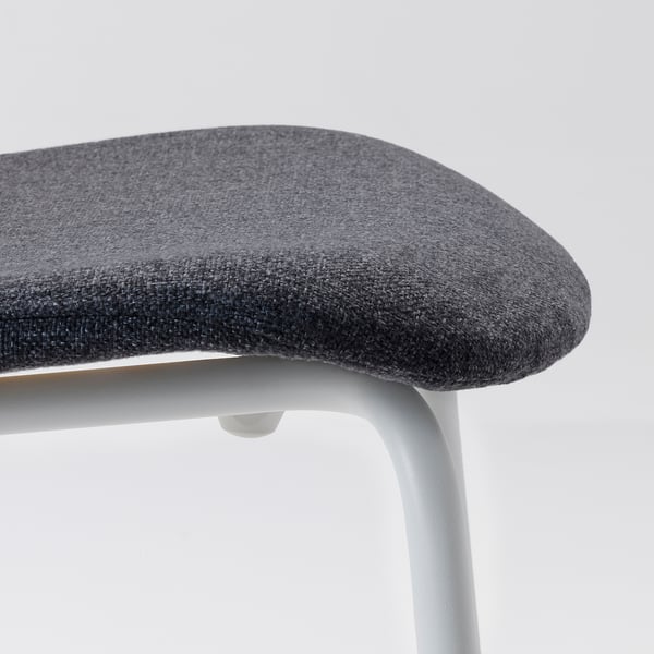 Modern chair with thick, dark grey fabric seat, featuring sturdy metal legs and clean lines for comfort and style.