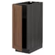An open METOD kitchen cabinet with a dark wood door and black frame. It has a modern, rectangular design.
