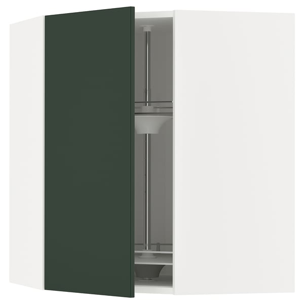 Image shows a corner kitchen cabinet in dark green with an open glass carousel.