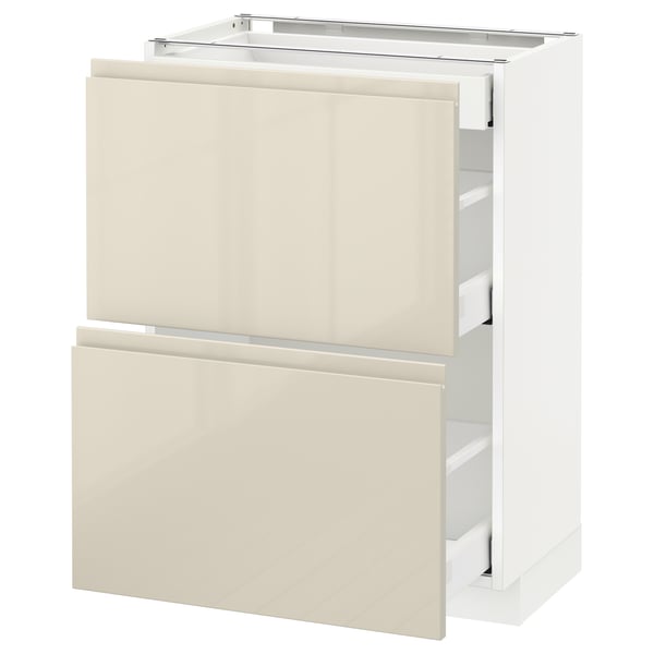 Modern kitchen cabinet in white and glossy beige with sleek drawers and no visible handles.