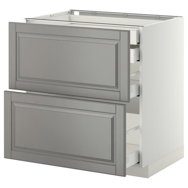 A white METOD kitchen cabinet with grey bodbyn drawers. It has a modern design with bevelled edges and two self-closing drawers.