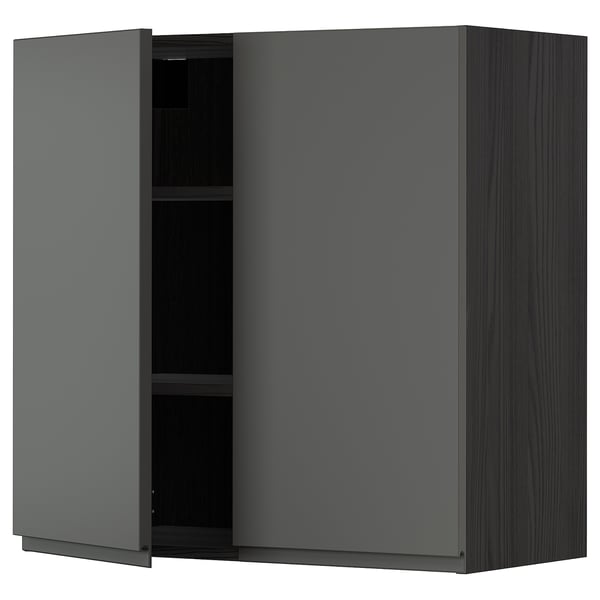 Dark grey ikea METOD kitchen cabinet with one open door, showing shelves.