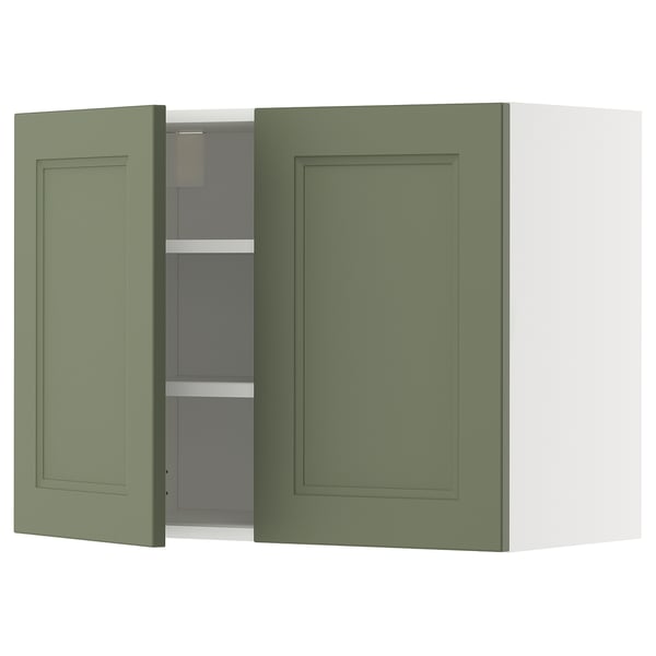 Green kitchen cabinet, two doors, wall-mounted, rectangular, modern design, filled with shelves.