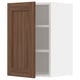 Walnut-colored kitchen cabinet with two shelves, door slightly open.