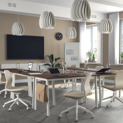 Modern MITTZON conference table with chairs, lamps, clock, plants.