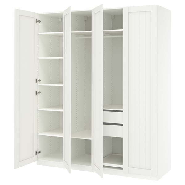 A white ikea PAX wardrobe with open doors, revealing empty shelves and drawers.