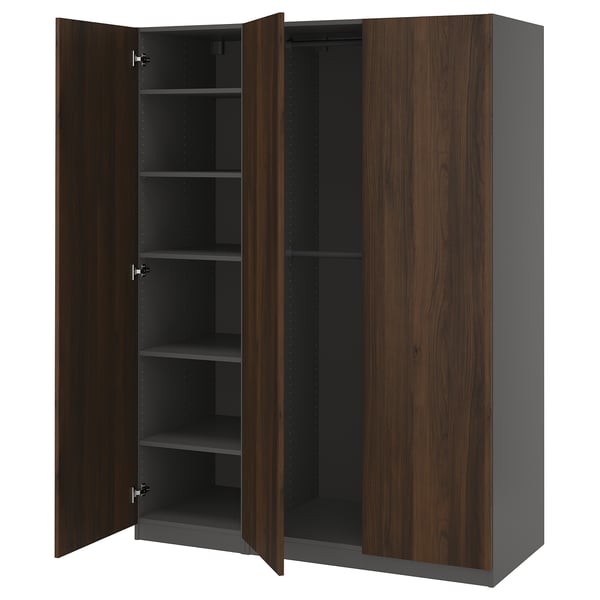 A PAX wardrobe in dark brown with grey interiors, featuring four open doors revealing shelving.
