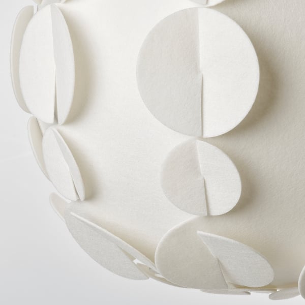 Flat white lampshade design resembling a sea urchin shell, arranged in a stylish pattern.