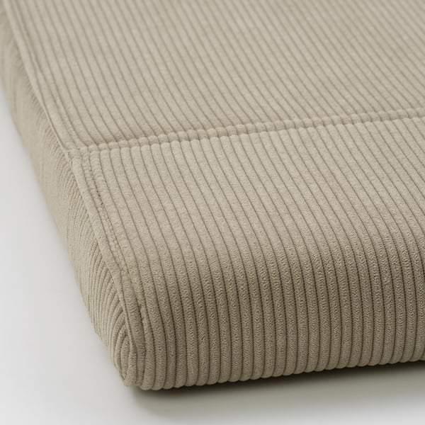 Close-up view of POÄNG footstool in beige corduroy, highlighting soft texture and sturdy stitching.