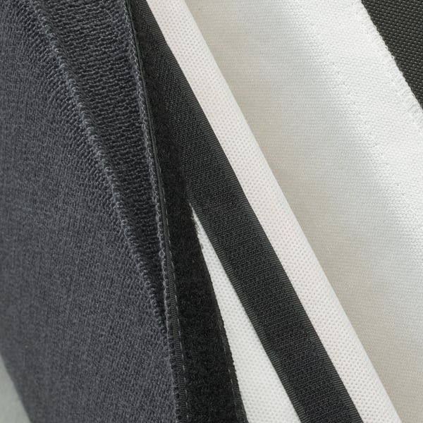 Close-up of chair cover with textured surface, showing removable melange design.